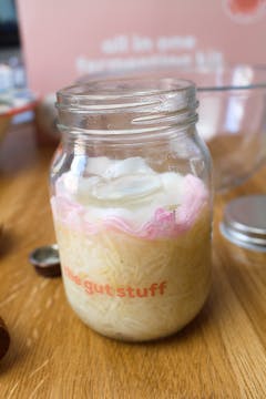 mooli radish fermenting in a glass jar