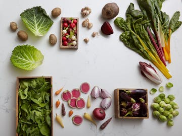 vegetables scattered on a white table