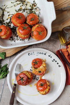 Stuffed tomatoes being served on an oddbox plate