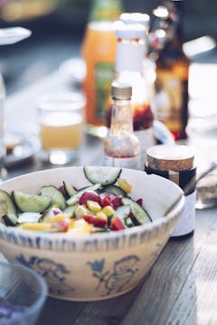 Bowl with mixed salad being served