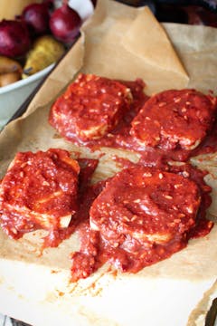 sticky pomegranate tofu steaks on a baking tray 