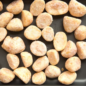 frozen roast potatoes on a baking tray
