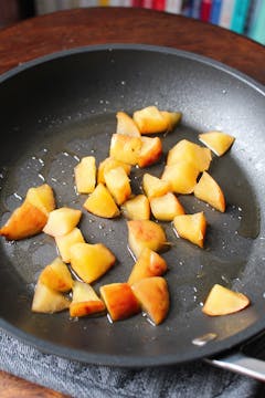 chopped apples cooking in pan