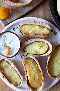 salt-baked potatoes cut open in salt crust in oddbox plate