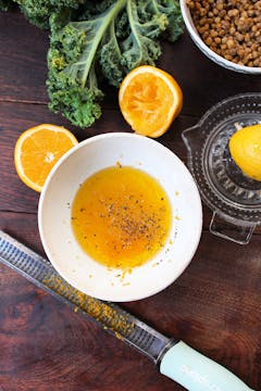 orange salad dressing in a white bowl