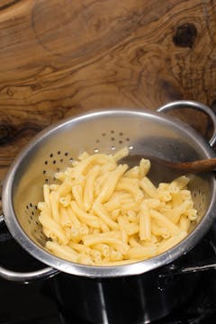 drained pasta in colander