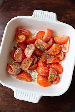 chopped tomatoes with oregano in a baking dish