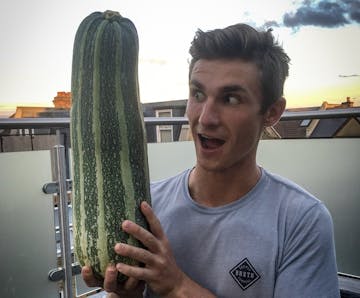 Our guest poster George from Biffen Kitchen, holding a marrow bigger than his head!