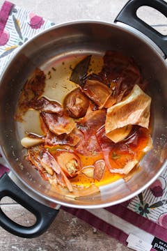 onion skin and other ingredients on a sauce pan for onion stock