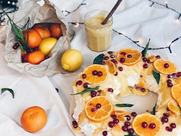 served decorated clementine, Lemon & cranberry meringue wreath