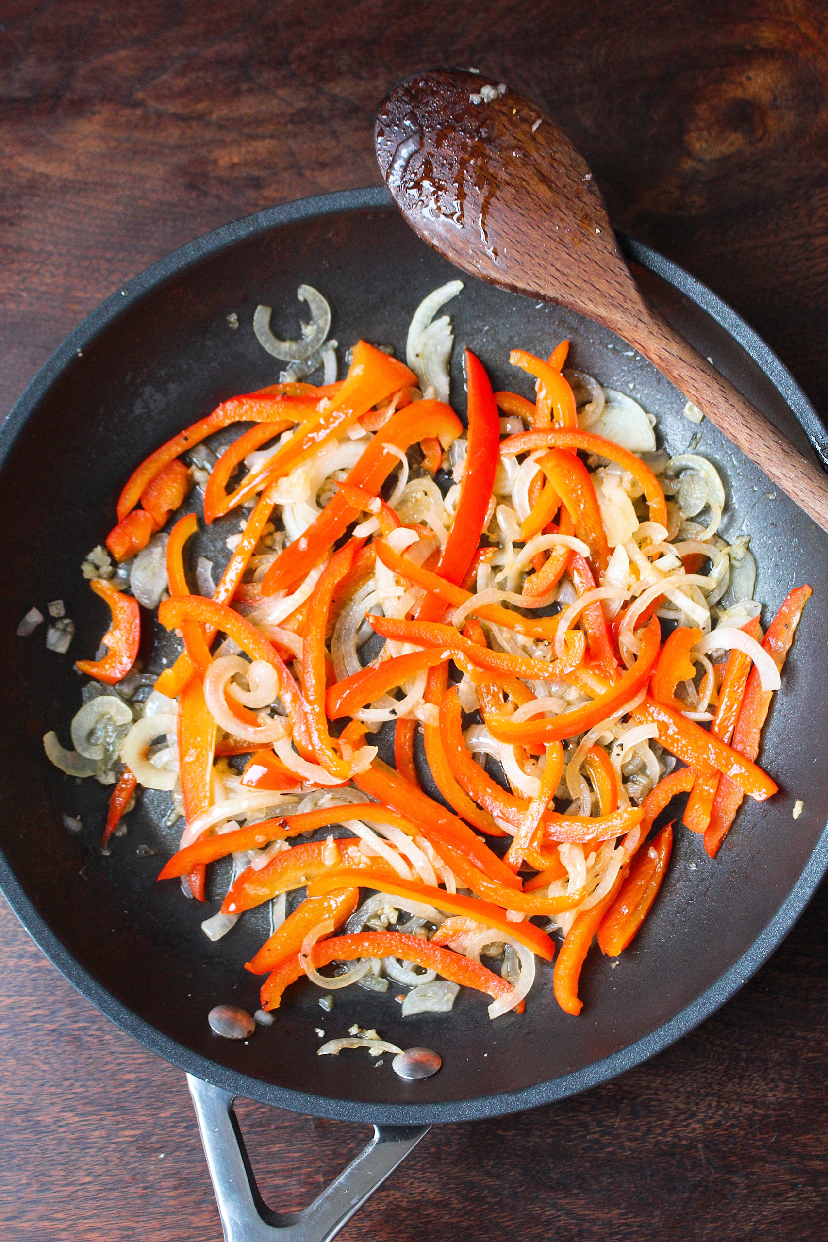 peppers and onions in a frying pan