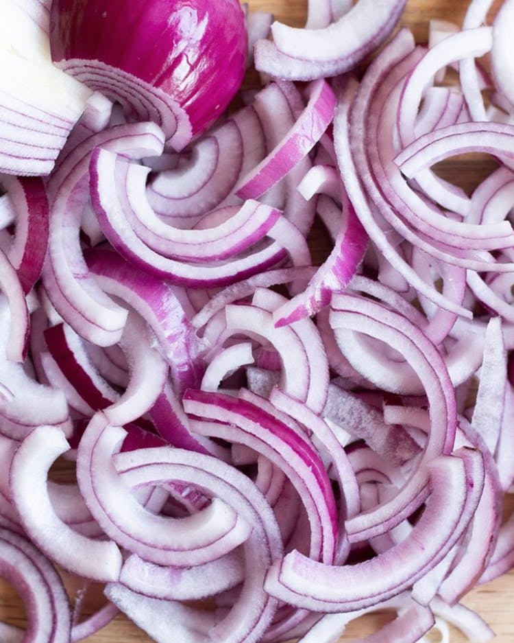 A pile of chopped red onions.
