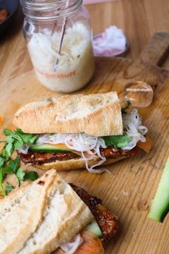 Vietnamese-style grilled tofu vegan sandwich on a chopping board