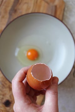 egg white and yolks removed from egg shell