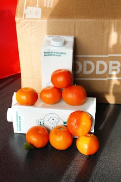 clementines and minor figures oat milk in front of an Oddbox
