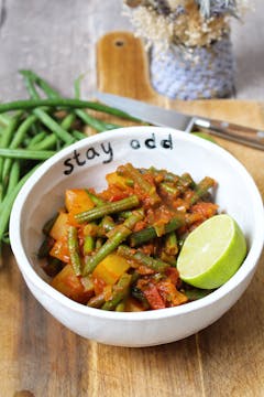 finished recipe served in bowl with half a lime