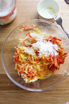 grated carrots in mixing bowl 