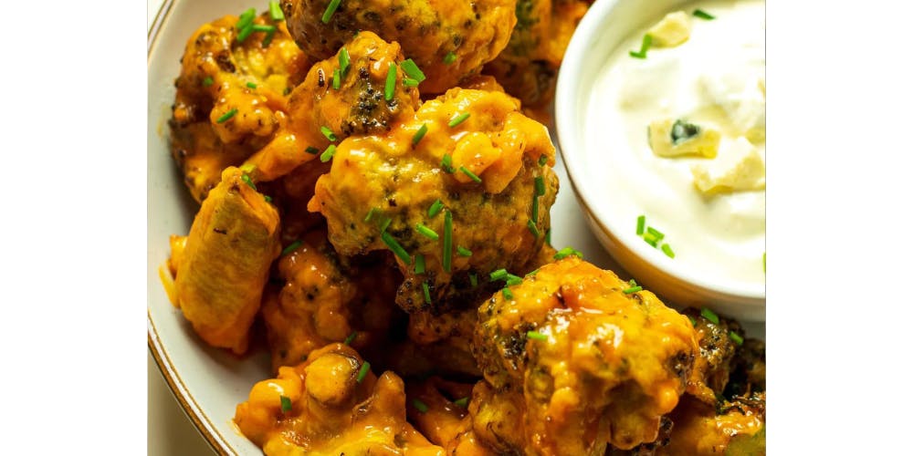 broccoli wings with a dip on this side