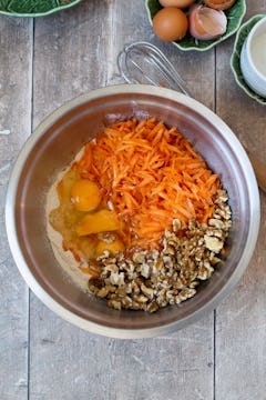 grated carrot and walnuts in in a bowl