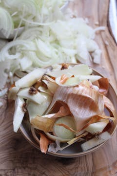 bowl of onion peel and finely chopped onion on the side