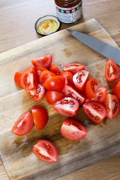 chopped tomatoes on board 