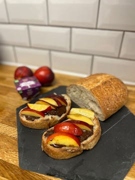 Chocolate coconut collab pot on toast with sliced nectarine