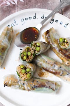 plate of 6 Roasted Sugar Snap Pea Rolls With spoon full Sesame Dipping Sauce