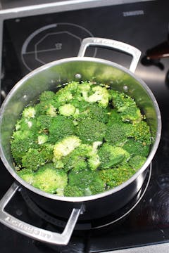 saucepan filled with broccoli head in water
