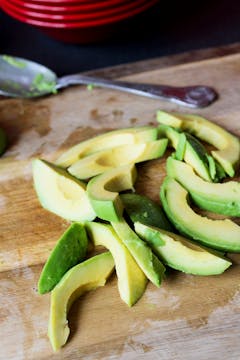 slices of avocado on a chopping board