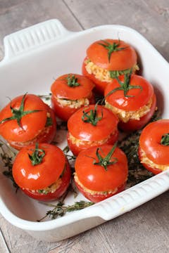 8 stuffed tomatoes in a cooking dish