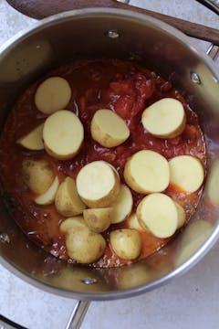 potatoes added to the sauce pan