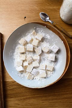 tofu and cornflour in bowl 