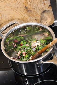 beetroot leaves cooking in small saucepan