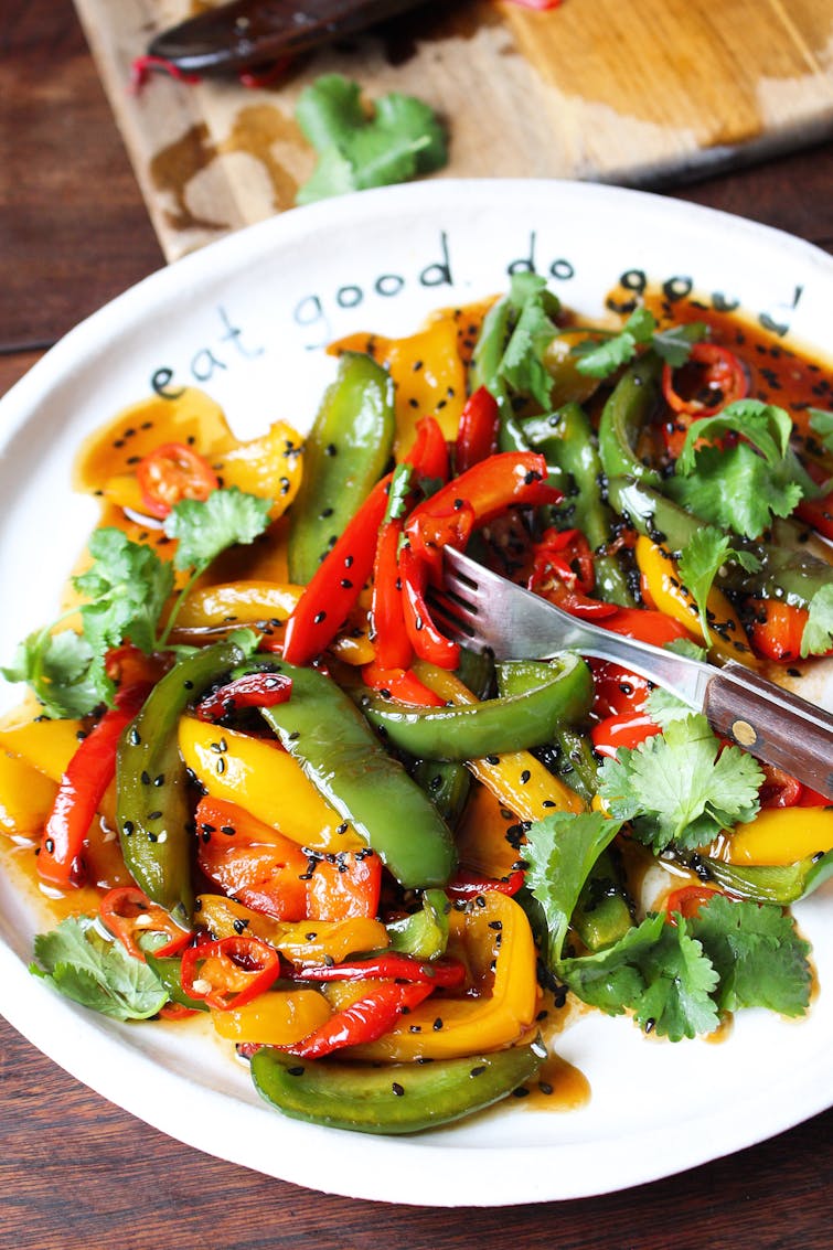 Kinpira style stir fried peppers on a white plate