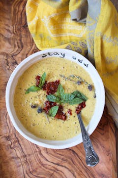 Sweetcorn and courgette chowder served on a bowl