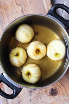 whole peeled apple in vanilla water