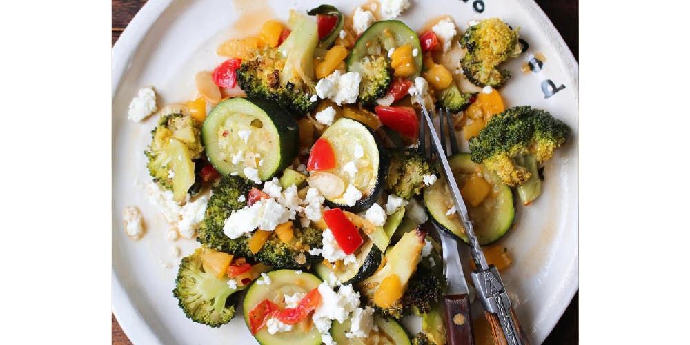 broccoli salad with courgette on a white plate