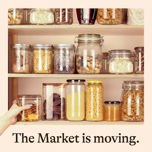 Jars filled with store-cupboard ingredients on a shelf.