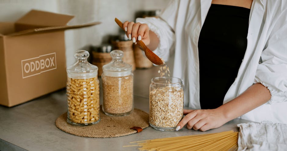 Glass jars being filled with loose refillables such as oats.