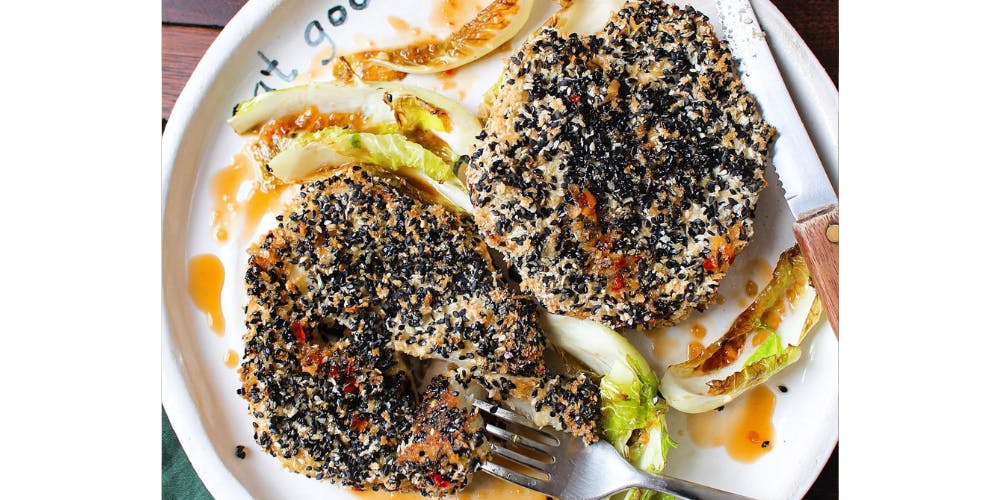 Cauliflower steaks on a white plate