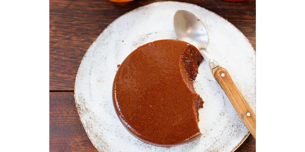 Persimmon chocolate dessert on a white plate