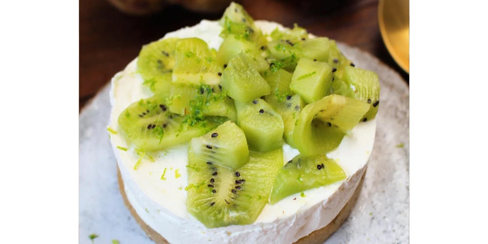 Kiwi cheesecake on a white plate