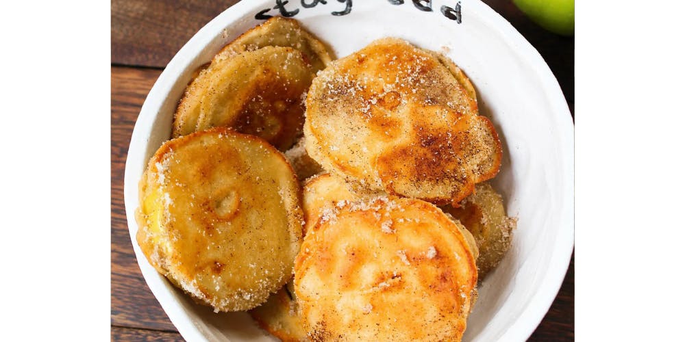 Apple fritters in a white bowl