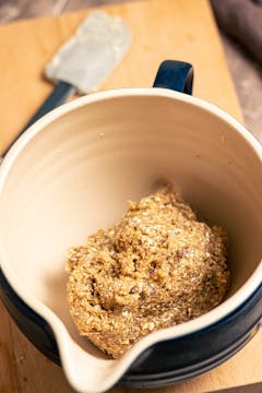 The dough for the cookies kneaded and combined with dates.