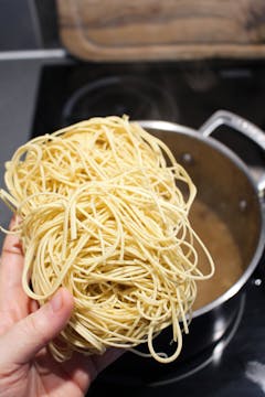 Noodles going in the pan