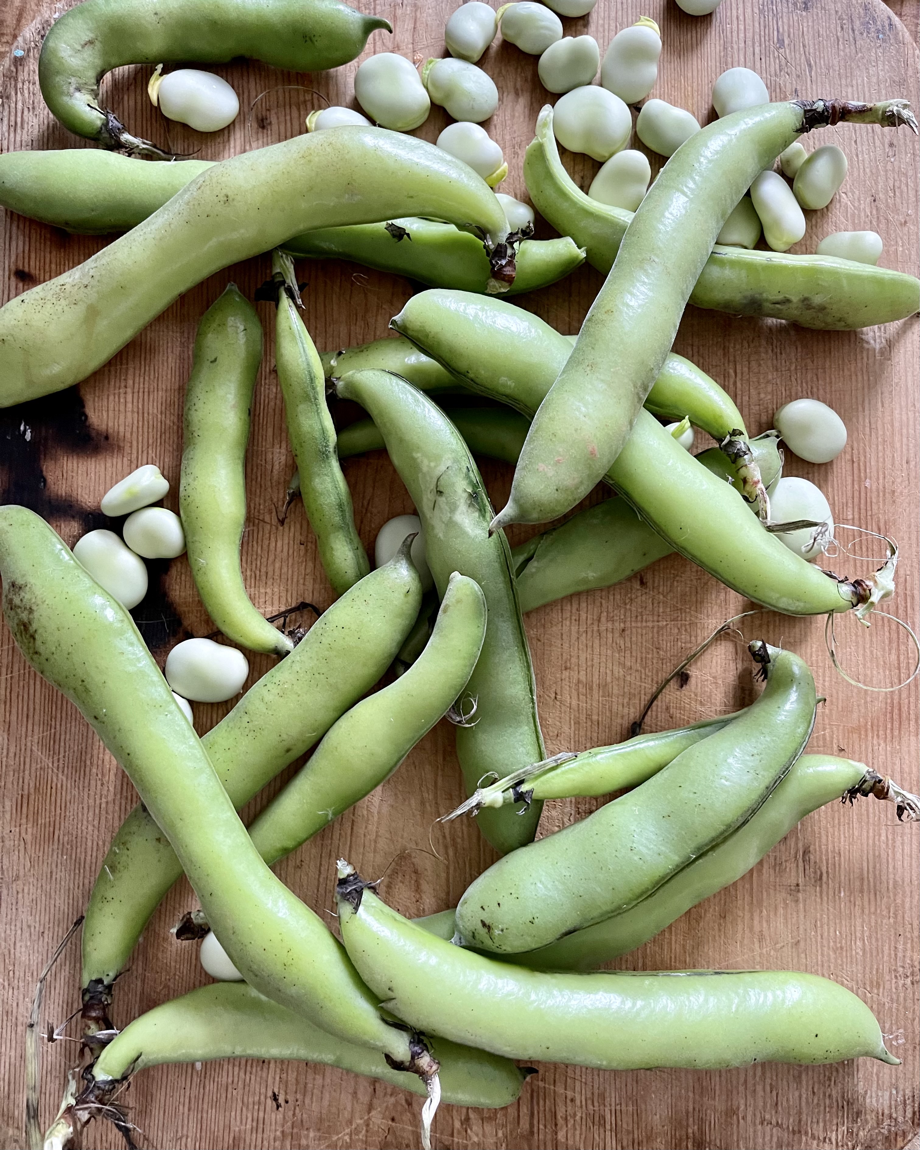 beans on a wooden chopping board