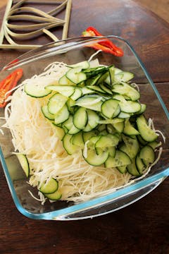 shredded cabbage and cucumber in a bowl 