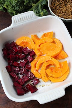 cut up pumpkin and beetroot in a baking dish