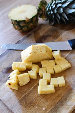 pineapple chunks on chopping board