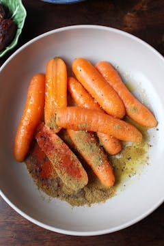 carrots and spices in mixing bowl 